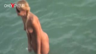 beach voyeur. gorgeous golden hair cutie riding her man on a exposed beach