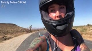 felicity feline riding on aprilia tuono motorcycle